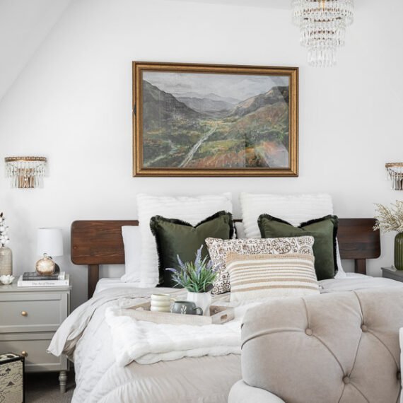 Elegant attic conversion in the Cotswolds featuring exposed beams, soft layered textures, and natural light—interior design by a Cotswolds-based designer.