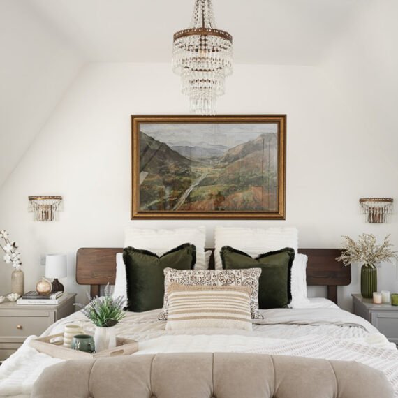Elegant attic conversion in the Cotswolds featuring exposed beams, soft layered textures, and natural light—interior design by a Cotswolds-based designer.